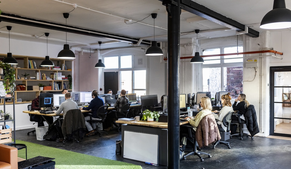 Businessmen and businesswomen working at desk in office