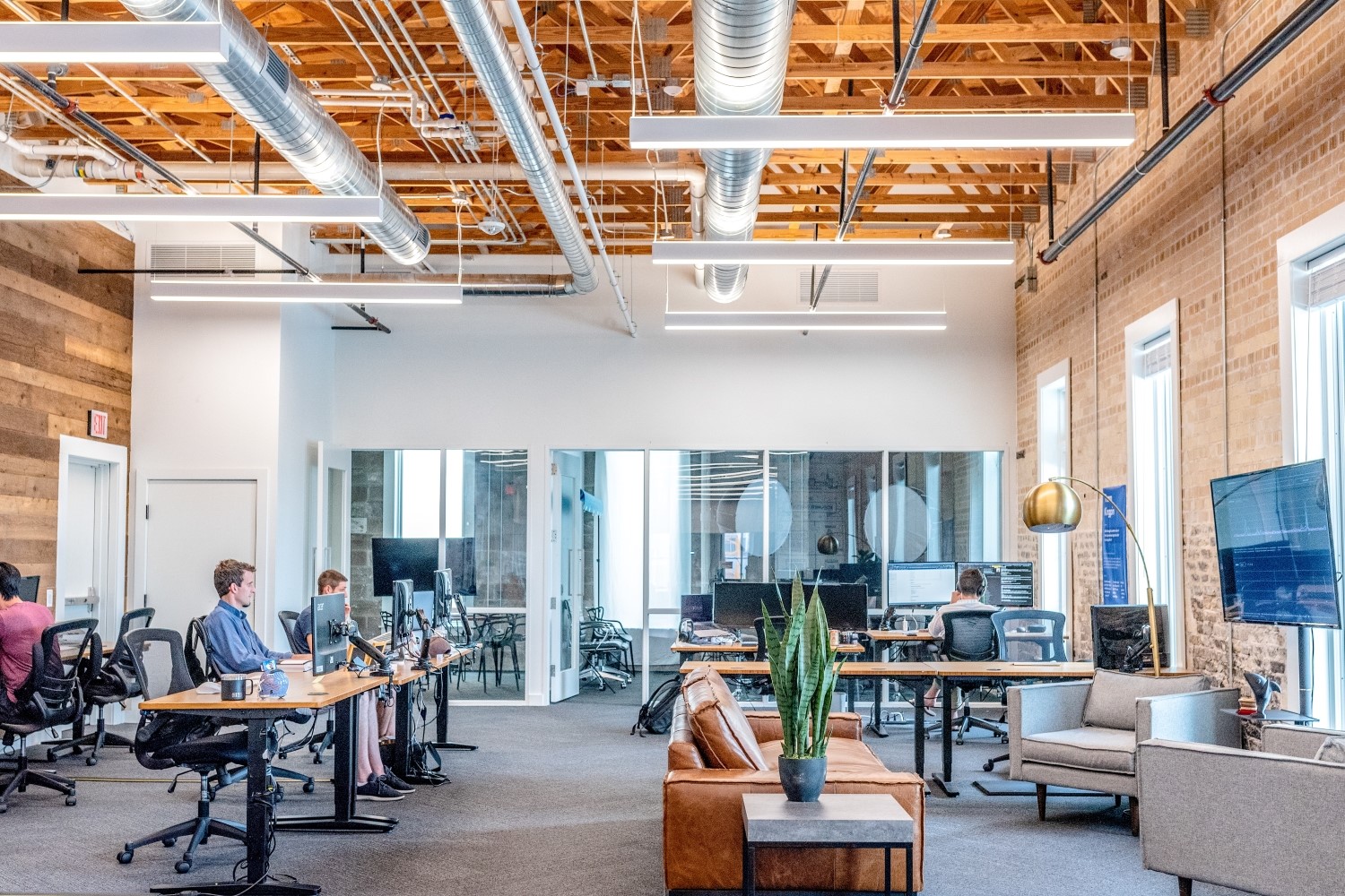 people working in a large open office space_1500x1000