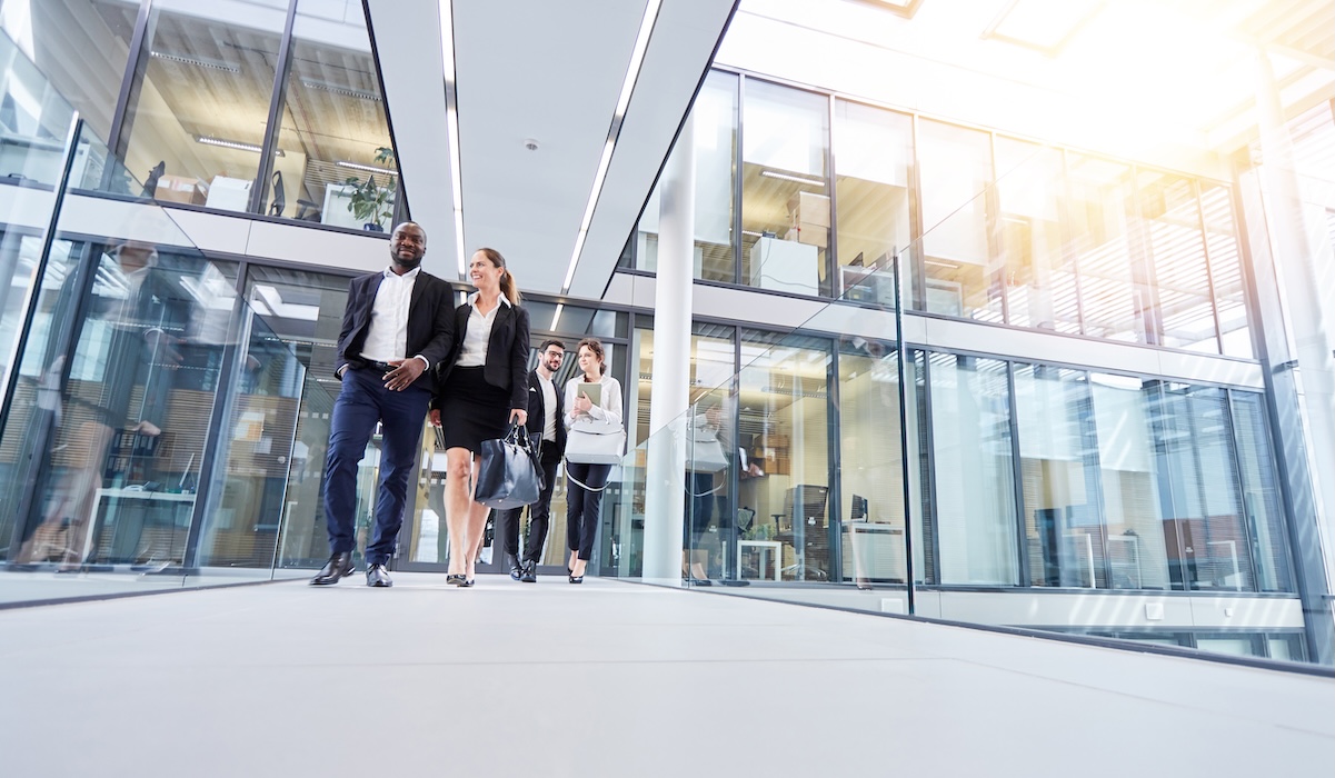 Group of business people go out together from office after work